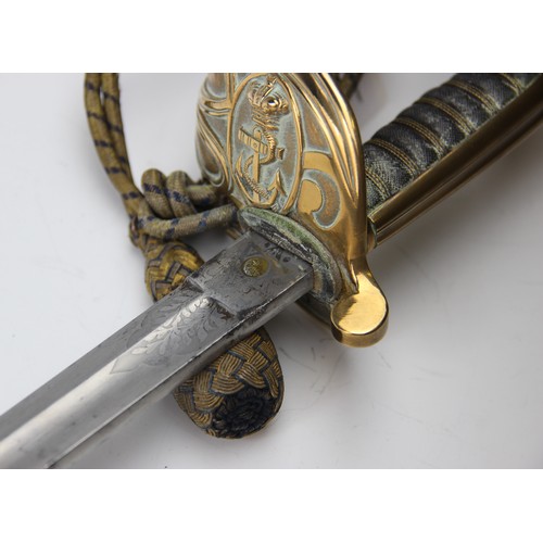 342 - A Naval officer's dress sword, 20th century, the 79.cm single edge curved fullered steel blade light... 