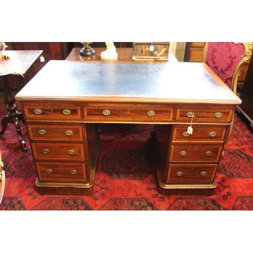 858 - An Edwardian mahogany and satinwood crossbanded twin pedestal desk, the rectangular moulded top with... 