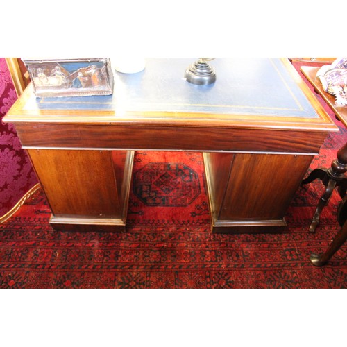 858 - An Edwardian mahogany and satinwood crossbanded twin pedestal desk, the rectangular moulded top with... 