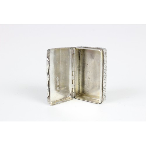 79 - A silver snuff box by Edward Smith, Birmingham 1851, of rectangular form engraved scrolling decorati... 