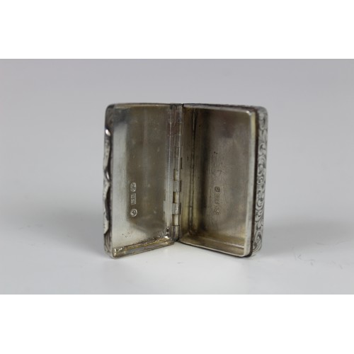 79 - A silver snuff box by Edward Smith, Birmingham 1851, of rectangular form engraved scrolling decorati... 