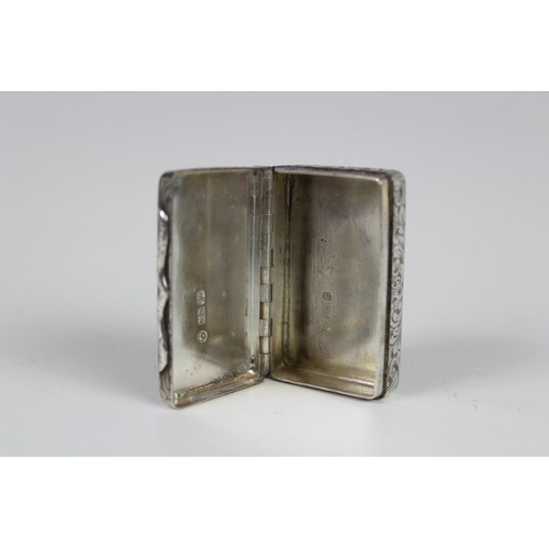 79 - A silver snuff box by Edward Smith, Birmingham 1851, of rectangular form engraved scrolling decorati... 