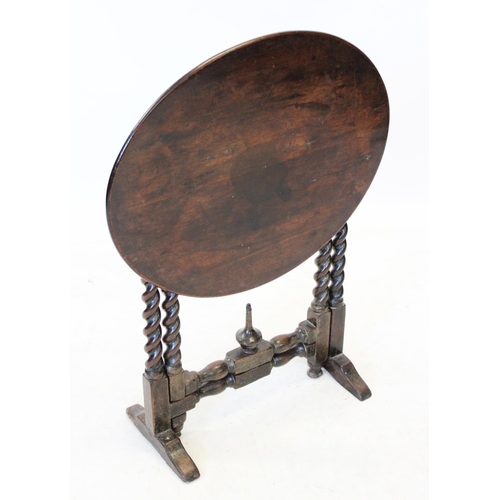 1000 - A 19th oak folding occasional table, the circular top raised upon barley twist legs extending to tre... 