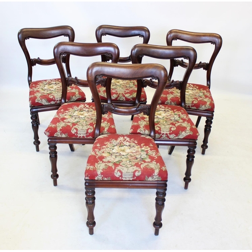 1001 - A set of six Victorian mahogany buckle back dining chairs, the rail back with carved scroll detail, ... 