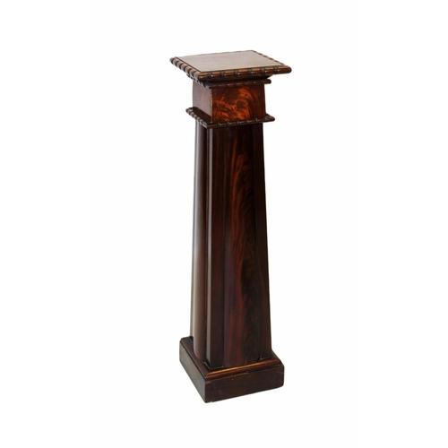 1003 - A 19th century and later constructed mahogany pedestal, the square top with a ring turned edge upon ... 