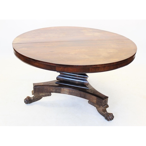 1005 - A William IV rosewood centre table, the circular tilt top raised upon a triform pedestal and conform... 