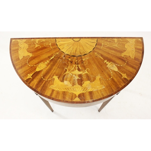 1016 - A 19th century and later inlaid mahogany hall table, the half moon top inlaid with trailing urns, on... 