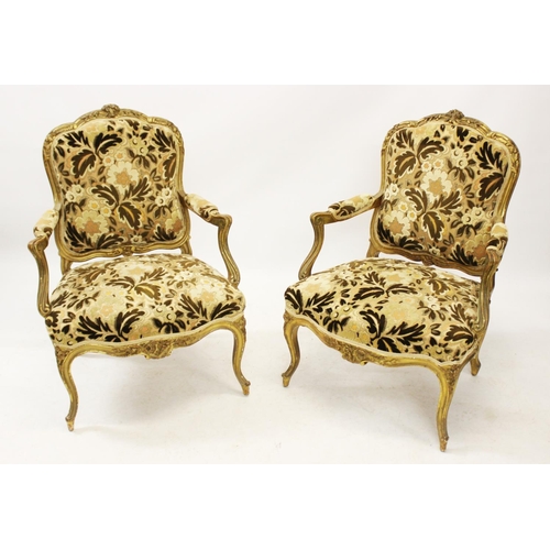 1018 - A pair of late 19th/ early 20th century Louis XVI style fauteuils, the embossed foliate fabric in au... 