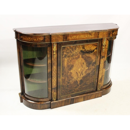 1019 - A Victorian burr walnut credenza, the shaped and moulded top above an inlaid frieze and a central do... 