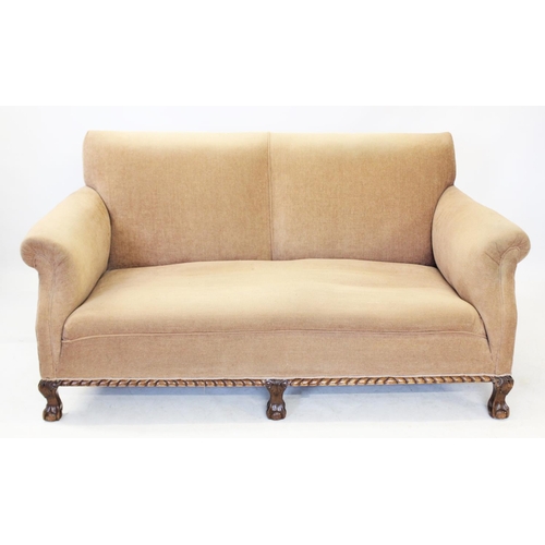 1035 - An early 20th century walnut and upholstered settee, covered in tan fabric, the padded scrolled arms... 