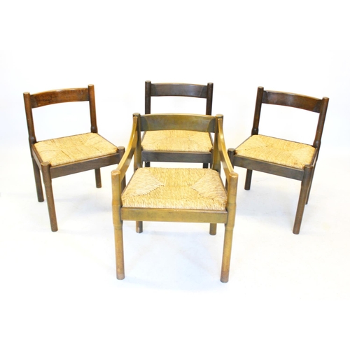 1045 - A set of eight Vico Magistretti 1970’s beech wood chairs, each with a concave rail back above an env... 