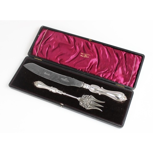 116 - An Edwardian silver handled bread knife and fork by Walker & Hall, Sheffield, both with filled silve... 