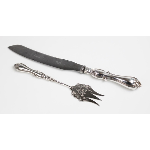 116 - An Edwardian silver handled bread knife and fork by Walker & Hall, Sheffield, both with filled silve... 