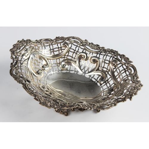 127 - A Victorian silver pedestal dish by William Comyns, London 1891, of oval form with moulded scrolling... 