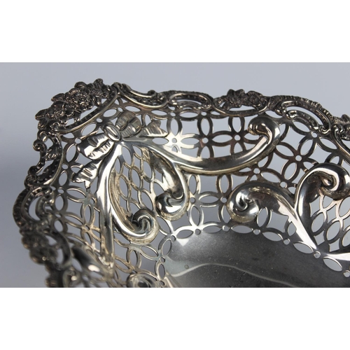 127 - A Victorian silver pedestal dish by William Comyns, London 1891, of oval form with moulded scrolling... 