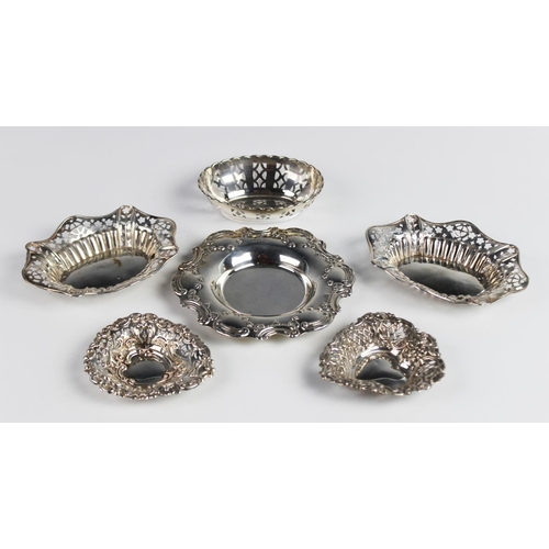 130 - A pair of Edwardian silver pin dishes, marks for 'CJ' Birmingham 1901, each of oval form with shaped... 