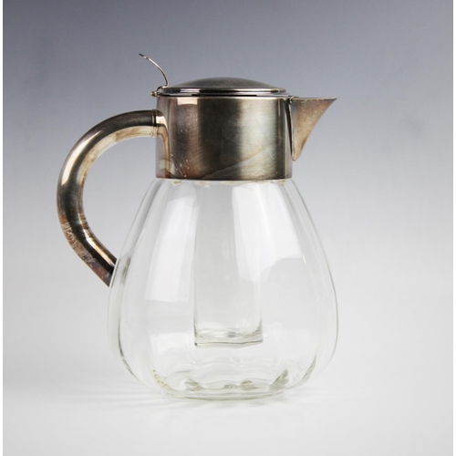 140 - A silver plated cut glass lemonade/cocktail jug, of faceted baluster form, plain polished mount with... 