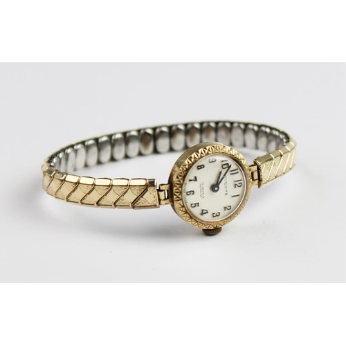 159 - A lady's vintage 9ct gold Everite 17 jewels incabloc wristwatch, the round pearlescent dial with Ara... 