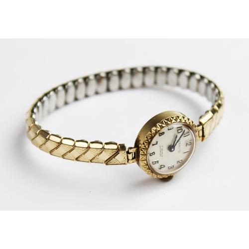 159 - A lady's vintage 9ct gold Everite 17 jewels incabloc wristwatch, the round pearlescent dial with Ara... 