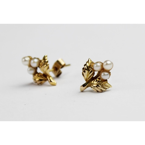 212 - A pair of 9ct gold floral sprig earrings, each designed as a flower set with three cultured pearls t... 