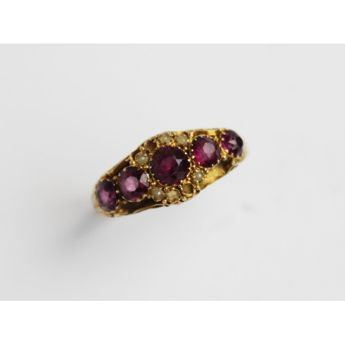 213 - A Victorian amethyst and pearl 15ct gold ring, comprising five graduated mixed cut amethysts (measur... 