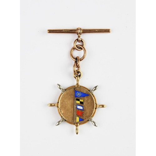 220 - A Victorian 15ct gold fob compass in the form of a ship's wheel, the reverse decorated with enamel m... 