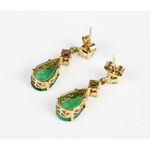 291 - A pair of emerald and diamond drop earrings, each comprising two round brilliant cut diamonds, (each... 