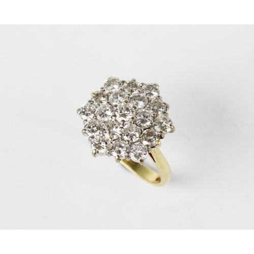 310 - A diamond cluster ring, the hexagonal shaped cluster comprising nineteen round brilliant cut diamond... 