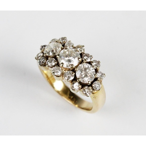 314 - A diamond cluster ring, comprising a central round brilliant cut diamond weighing approx. 0.75 carat... 