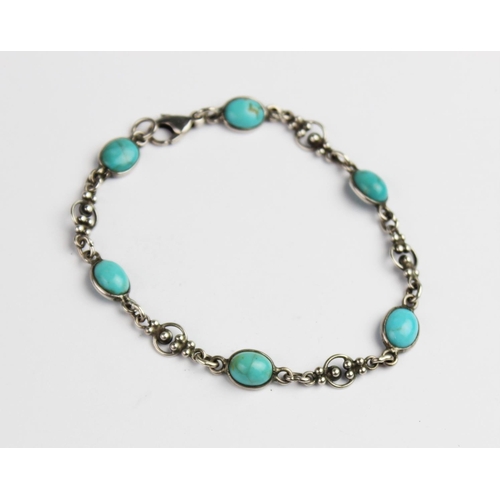 322 - An Arts & Crafts style silver and turquoise bracelet, comprising six polished turquoise cabochons ea... 