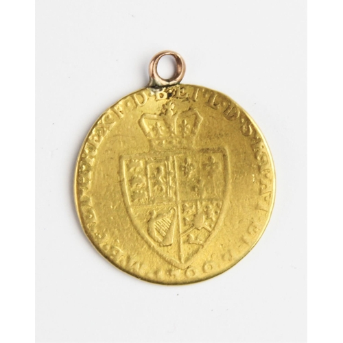 334 - A George III guinea, date worn (17--), spade shield to reverse, with soldered pendant mount, weight ... 