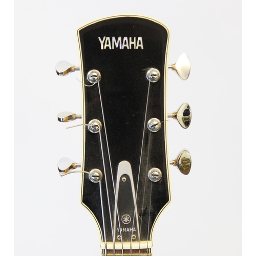 358 - A Yamaha AE11 Semi-Acoustic guitar, probably circa 1969, in original hard case, with lead, tuner, sp... 