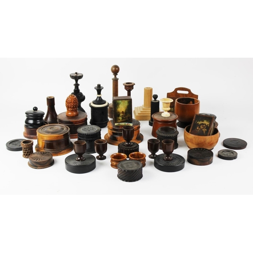 363 - An extensive collection of treen pieces, 19th century and later, to include turned lidded and open v... 