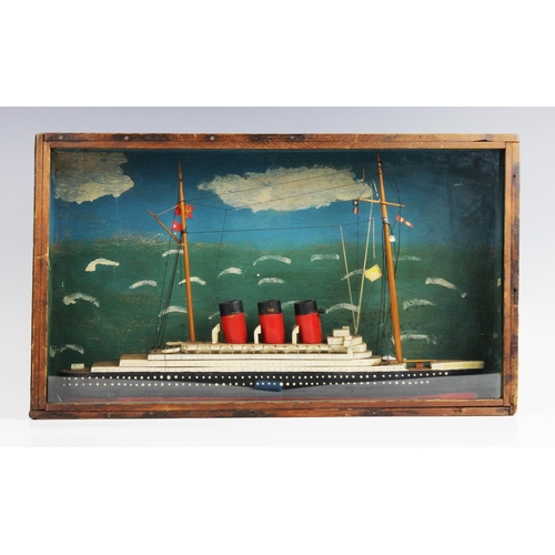 370 - A vintage cased handmade, scratch-built model of a three funnelled ocean going liner, the wooden mod... 