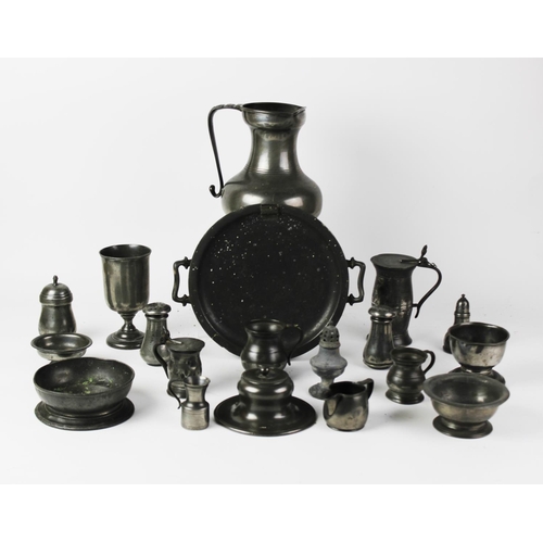 387 - A collection of pewter, 18th century and later, to include a water jug, 22.5cm high, two lidded meas... 