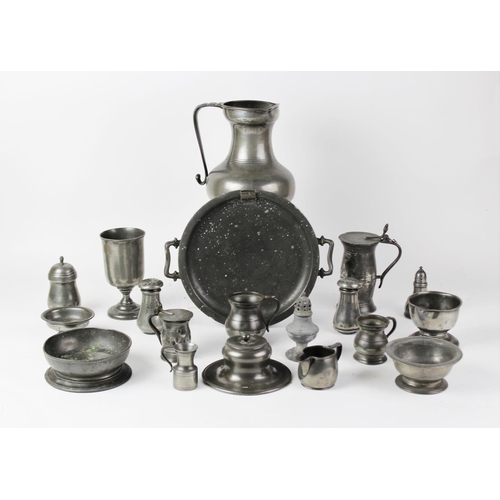 387 - A collection of pewter, 18th century and later, to include a water jug, 22.5cm high, two lidded meas... 