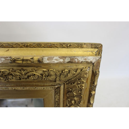 388 - A 19th century and later gilt wood and gesso wall mirror, the later mirrored plate within a frame mo... 