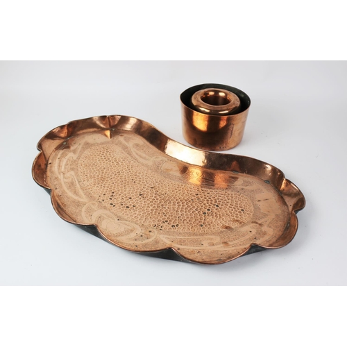 396 - An Arts & Crafts copper tray in the manner of J.S & S Sankey, 57cm wide, with two Victorian copper m... 