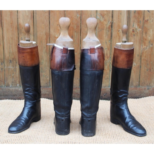 434 - A pair of Peal and Co Ltd leather hunting boots, black and tan, with Peal & Co trees and another mat... 