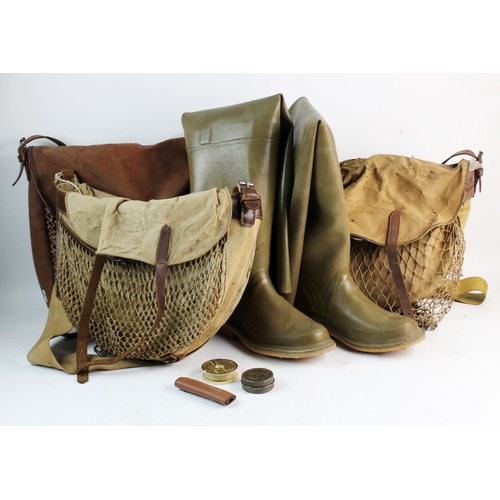 479 - A collection of four assorted vintage angling bags and fishing equipment, leather and canvas, along ... 