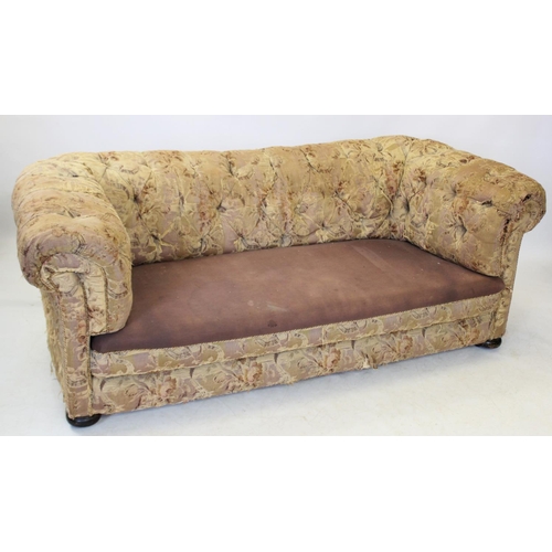 953 - A Victorian foliate pattern Chesterfield type settee, with deep set button back and arms, raised upo... 