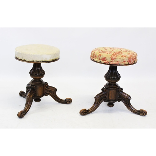 954 - A pair of Victorian walnut adjustable piano stools, each with a circular revolving upholstered seat ... 