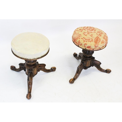 954 - A pair of Victorian walnut adjustable piano stools, each with a circular revolving upholstered seat ... 