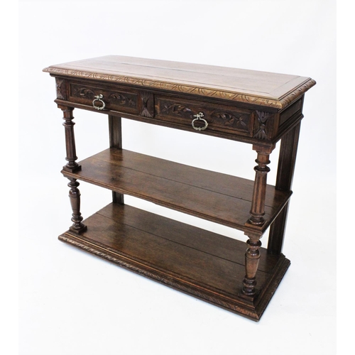 957 - A Victorian oak and marble top buffet, the rectangular hinged top with a carved border enclosing a w... 