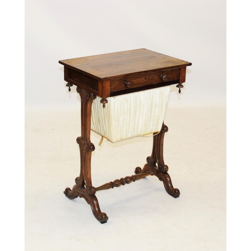 967 - A mid 19th century rosewood sewing table, having a single frieze drawer opposed by a faux drawer, ab... 