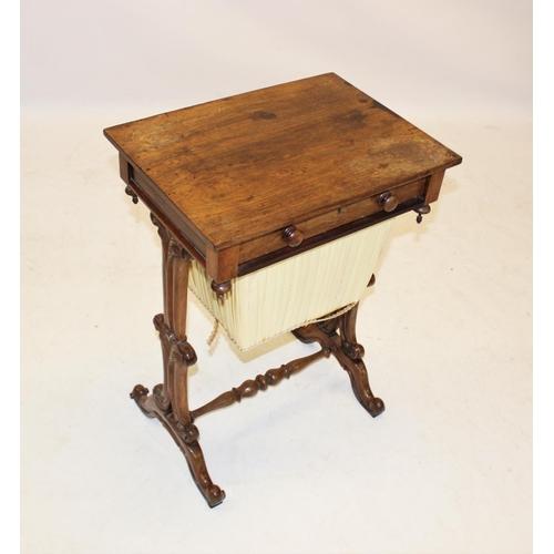 967 - A mid 19th century rosewood sewing table, having a single frieze drawer opposed by a faux drawer, ab... 