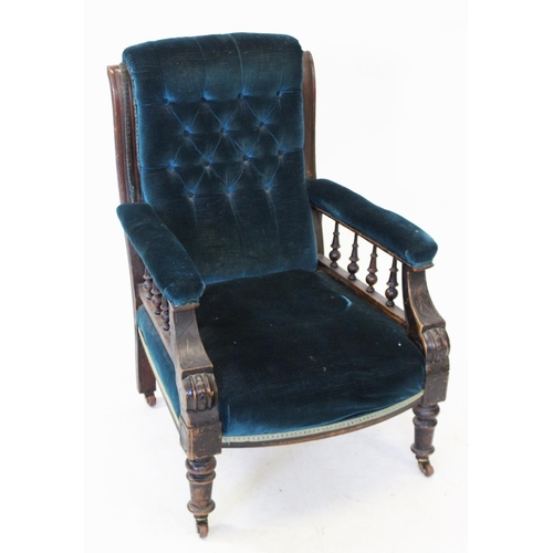 978 - A Victorian walnut and upholstered drawing room chair, the upholstered arms raised upon turned spind... 