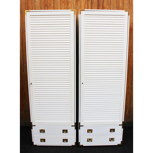 980 - A pair of white painted wardrobes, late 20th century, with brass Campaign style handles, along with ... 