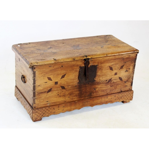 989 - A 19th century continental pine blanket chest, the hinged cover centred with an inlaid star flanked ... 