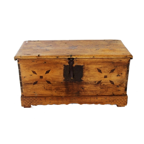 989 - A 19th century continental pine blanket chest, the hinged cover centred with an inlaid star flanked ... 